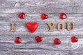 I love you, wooden lettering, gray background, postcard Happy Valentine day, flat lay Royalty Free Stock Photo