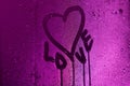 I love you written on condensation glass with purple light Royalty Free Stock Photo