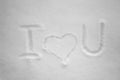 I love you written by hand in the fresh snow at sunny day. Royalty Free Stock Photo