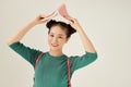 I`m home. Closeup photo of pretty funny lady hold open book homework under head fooling around childish mood isolated light