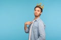 I`m king! Portrait of ambitious man wearing golden crown and pointing himself, looking with arrogance