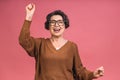 I'm winner! Portrait of a cheerful happy senior mature woman, grandmother gesturing victory Royalty Free Stock Photo