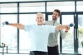 I'm working on being more independent. Shot of a friendly physiotherapist helping his senior patient work out with Royalty Free Stock Photo