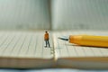 I May Be Left Handed but I Am Right is Standing on a Notebook Writing with the Left Hand Pen Table Royalty Free Stock Photo