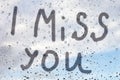 I miss you - The inscription on the misted glass after the rain