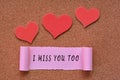 I miss you too label on Torn paper with heart shape on wooden background Royalty Free Stock Photo