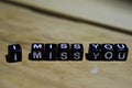 I miss you written on wooden blocks. Inspiration and motivation concepts Royalty Free Stock Photo