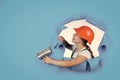 I need help. kid wear helmet on construction site. teen girl plasterer with tool spatula. child on repairing work Royalty Free Stock Photo
