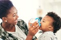 I need him just as much as he needs me. a mother giving her baby boy bottle. Royalty Free Stock Photo