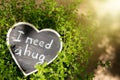 I need a hug hand drawing phrase on a heart, Sharing a Hug concept Royalty Free Stock Photo