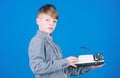 I need modern gadget instead this retro. Outdated gadget. Retro and vintage. Yard sale. Retrospective study. Boy hold Royalty Free Stock Photo