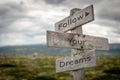 Follow your dreams signpost.