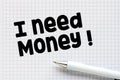 I NEED MONEY word written on a piece of paper Royalty Free Stock Photo