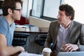 I need you on this. two businessmen talking in the office. Royalty Free Stock Photo
