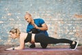 I need your body to be in line. a young woman working out with her personal trainer. Royalty Free Stock Photo