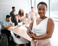 I never attend meetings without it. Cropped portrait of an attractive young businesswoman attending a meeting in the Royalty Free Stock Photo