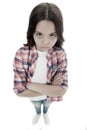 I am not talking to you. Girl serious face offended white background. Kid unhappy looks strictly. Girl folded arms on
