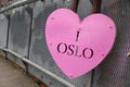 I Oslo heart-shaped pink lock hanging on the bridge