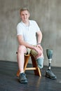 I overcame MY disability. a young amputee sitting in a gym.