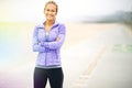 I owned that path behind me. Portrait of a young woman in sportswear standing at the beach. Royalty Free Stock Photo