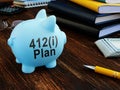 412i plan on the side of piggy bank. Pension concept.