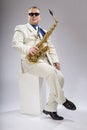 Saxophonist Caucasian soloist plays the saxophone Royalty Free Stock Photo