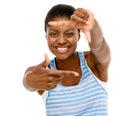 I see you too. Studio shot of a young woman making a finger frame against a white background. Royalty Free Stock Photo
