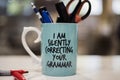 `I am silently correcting your grammar` coffee mug Royalty Free Stock Photo