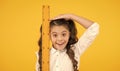 I am still growing. Tall kid. Kid school uniform hold ruler. Pupil cute girl with big ruler. Geometry school subject