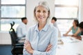 I stuck at it until I made it to the top. Portrait of a confident mature businesswoman standing with her arms crossed in Royalty Free Stock Photo