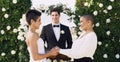 I take you to be my lawfully wedded wife. an affectionate young lesbian couple smiling at each other while saying their Royalty Free Stock Photo