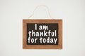 i am thankful today lettering on chalkboard with wooden frame and thread