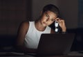 I think I need to break up with my job. a young businesswoman looking worn out while using a laptop during a late night