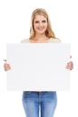 I think your copy is awesome. Studio shot of a young woman holding a blank sign in front of her isolated on white.