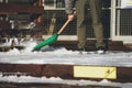 I took a picture of snow piled up and a person removing snow