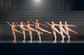 I only try to dance better than myself. a group of ballet dancers practicing a routine on a stage. Royalty Free Stock Photo