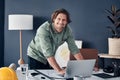 I turn visions into a reality. Portrait of a handsome young architect working on a laptop in his office. Royalty Free Stock Photo