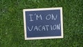 I am on vacation written