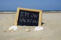 I am on vacation written on a chalkboard