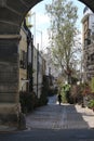 The archway leads the way to the residences in the area.