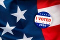 i voted biden presidential election campaign 2020 vote button; pin laying on the american flag.