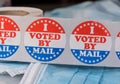 I Voted by Mail paper sticker on medical face mask to illustrate voting by mail in election Royalty Free Stock Photo