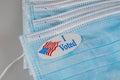 I Voted paper sticker on medical face mask to illustrate in person voting