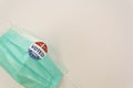 I Voted sticker on protective face mask on white background with copy space. Concept of Voting in the USA during coronavirus Royalty Free Stock Photo