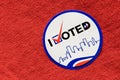 I Voted sticker on a red shirt indicating Republican party. Royalty Free Stock Photo
