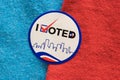 I Voted sticker split between red and blue materials indicating both Democrat and Republican party. Royalty Free Stock Photo