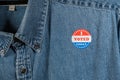 Blue denim working clothing with I Voted sticker