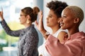 I wanna ask something please. a group of attractive young businesswomen raising their hands to ask a question during a