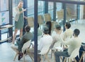 I want everyone to participate. a young businesswoman giving a presentation at work.