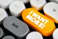 I want more - expresses a desire for additional quantity, quality, or variety of something, text button on keyboard Royalty Free Stock Photo